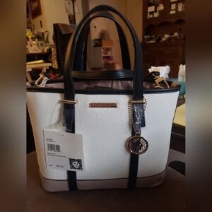 Chic White and Black Tote with Textured Leather and Metallic Emblem